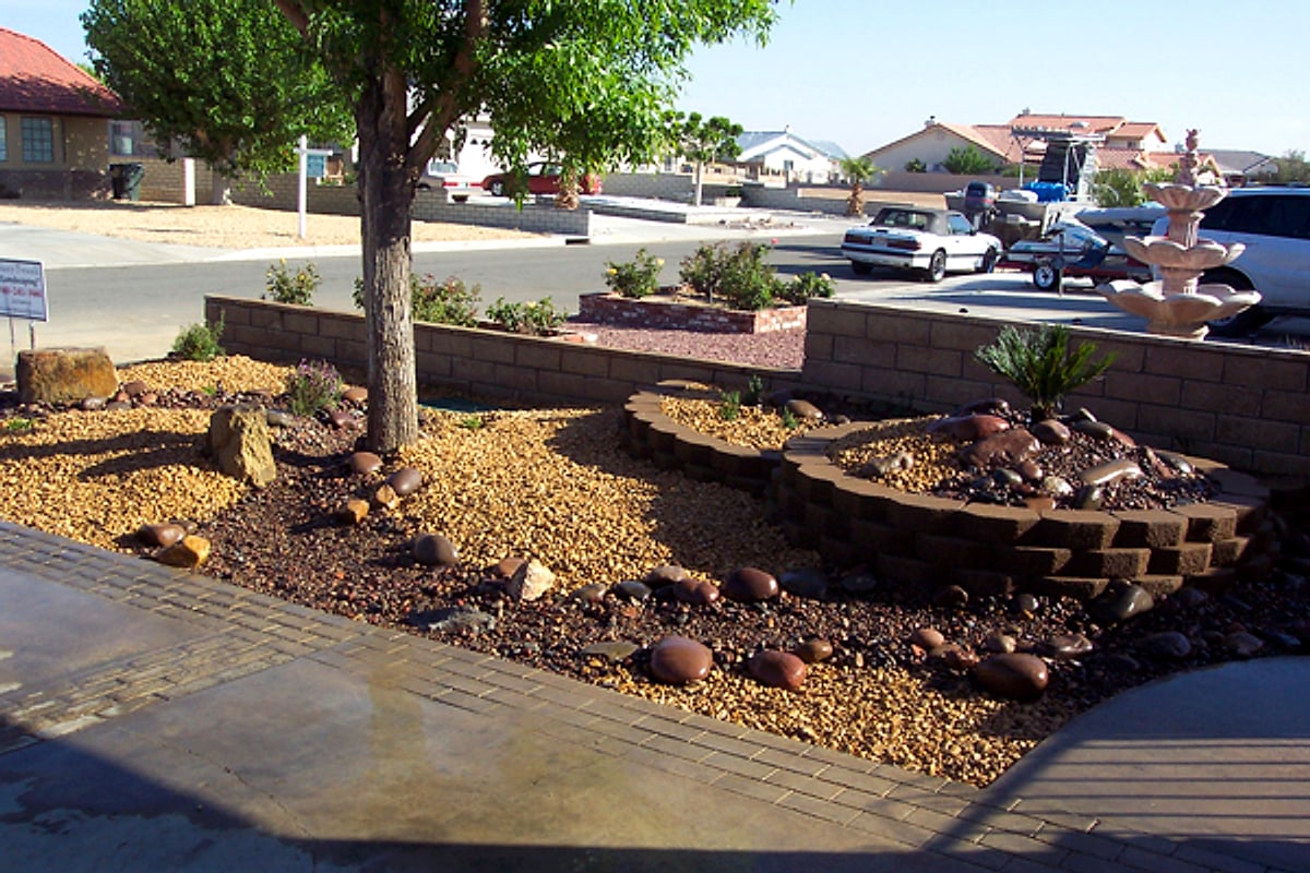 Front yard block planters with a tiered fountain